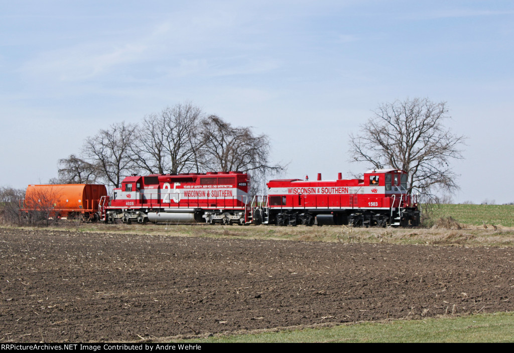 Two engines and one ballast hopper approaching County VV